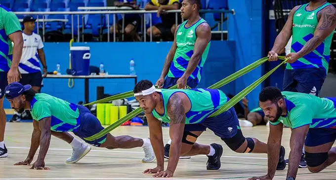 Swire Shipiing Fijian Drua reps (from left) Frank Lomani, Peni Matawalu (standing) and Zuriel Togiatama at the Vodafone Arena at Laucala Bay, Suva, on April 25, 2022. Photo: Leon Lord.