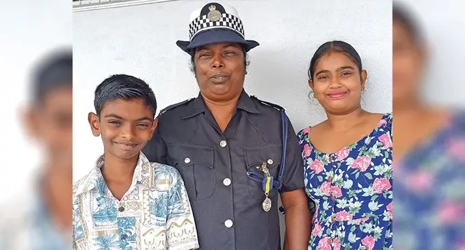 Police Constable Sadamma flanked by her children Shivam Chetty and Riha Chetty at the Labasa Civic Centre on January 10, 2025. Photo: Shratika Naidu 