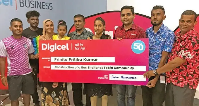 From Left: Tabia Community members Vishal Chand, Ritesh Prasad, Khatiza Bi, Zariyah Hussein, and Prinita Kumar receiving cheque from digicell head of home and entertainment Ravneet Prabhu with staff Zynal Hussein and Rama Naicker in Labasa office on 27th November, 2020. Photo SHratika Naidu 