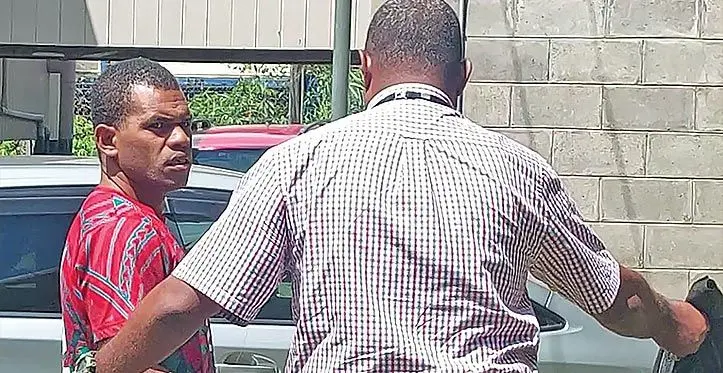 Livai Naqaro is escorted to the Magistrates Court in Ba on March 16, 2023. Photo: Salote Qalubau
