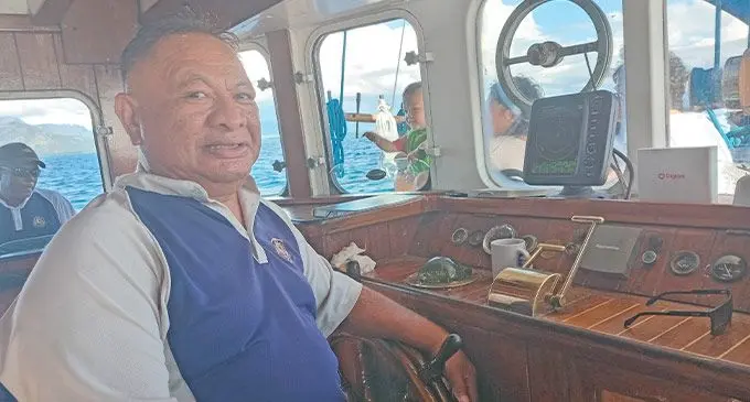 Captain Filikesa Paulo Mario at the wheel on board, Whales Tale.  PHOTO: Waisea Nasokia