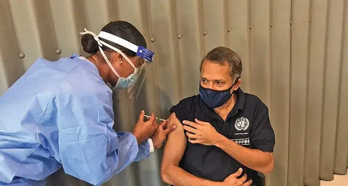 United Nations Resident Coordinator in Fiji and the Pacific Sanaka Samarasinha receiving his second jab of the AstraZeneca vaccine at Kadavu House in Suva on June 23, 2021.  Photo: Inoke Rabonu