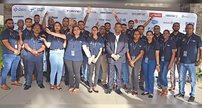 Datec Fiji Pte Limited chief executive officer, Satyen Singh with the Datec staff at the Fiji Tech Summit 2022 at the Intercontinental Fiji Golf Resort and Spa in Natadola on November 4, 2022. Photo: Nicolette Chambers