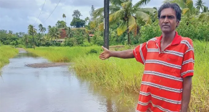Resident Jai Karan, near the flood waters that affect their daily lives at Boca, Bulileka, in Labasa recently. Photo: Sampras Anand 