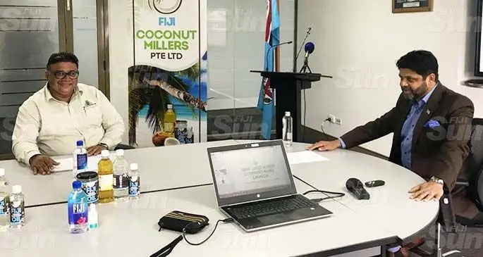 Fiji Coconut Millers chairman Raj Sharma (left) with Attorney-General and Minister for Economy Aiyaz Sayed-Khaiyum who officiated at the rebranding of Fiji Coconut Millers(Pte) Ltd in Suva yesterday. Photo: Frederica Elbourne