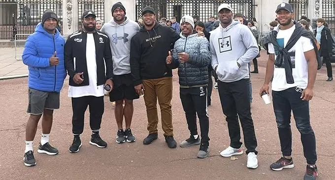 Fiji Airways Flying Fijians Eroni Mawi (fourth from left), Osea Waqa (fifth from left) and Mosese Voka (sixth from left) with Fijian fans in London on November 14, 2019. Photo: FRU Media