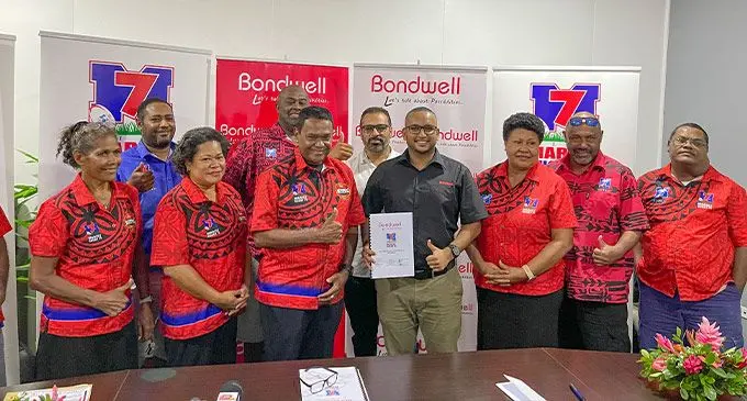 Marist Rugby Club president Lawerence Tikarama (standing fron third from left) with Janty Bondwell Limited digital marketing manager Sidharth Prakash with club executives and staff on February 28, 2023. Photo: Janty Bondwell