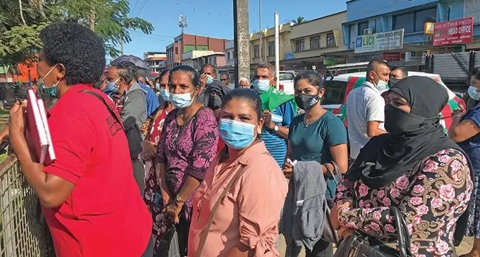 Mehnaz Bi (standing front/ second from left) outside the gate at St Mary’s Primary School in Labasa on June 23, 2021. Physical distancing was practised at the school during the COVID-19 vaccination drive.  Photos: Laisa Lui
