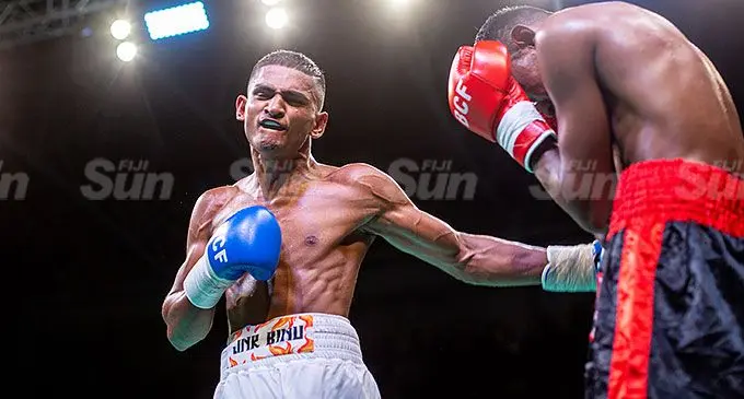 Junior Binnu Singh (left) connects a body punch on Zeeran Zulfikar Ali in their Fiji featherweight title fight on June 22, 2024. Photo: Josua Buredua