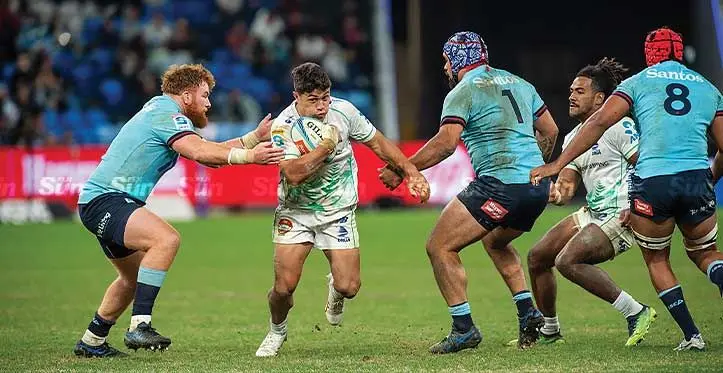 Swire Shipping Fijian Drua first five eight Caleb Muntz (with ball) tries to escape the Waratahs defence during their round 14 Shopn N Save Super Rugby Pacific match at Allianz Stadium, Sydney, Australia on May 20, 2023. Photo: Leon Lord