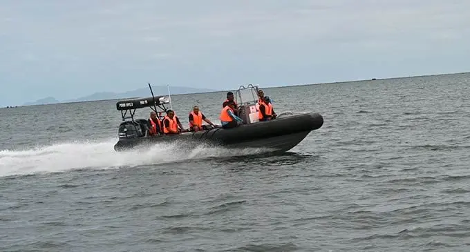 Police officers in one of the rigid inflatable boats.
