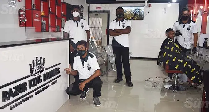 Managing director Suhail Ahmad (first from left) at the Razor Kings Barbers shop in Nadi. Photo: Waisea Nasokia