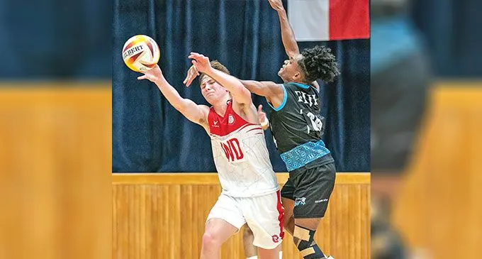 Crest Fiji men’s Joseva Nawaqa goal attack (GA) defends against an England player during their match at Jurong East Sports Centre on December 2, 2024. Photo: : England Men’s & Mixed Netball Association
