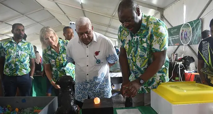 FNU’s College of Agriculture, Fisheries and Forestry Dean Professor Paul Iji showing his college’s display to the Prime Minister Voreqe Bainimarama at the FNU Open Day. Photo : FNU