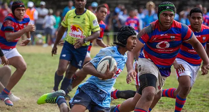 Queen Victoria School Under-14 halfback Neumi Qaranivalu runs away from the   Marist Brothers High School defence during the Vodafone Super Deans National Trophy semifinal at Prince Charles Park, Nadi on October 1, 2022. Photo: Leon Lord