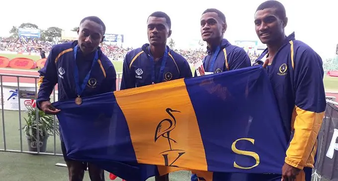 Ratu Vilkesa Vonolagi (right) with the Ratu Kadavulevu School 4x400 metres relay team after winning gold in the senior boys division on August 20, 2022. Photo: Sereana Salalo