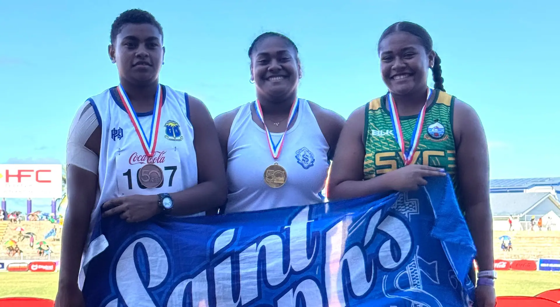  Sulie-Tanya Matea (right) with Saint Joseph's Secondary School's Maryann Macedru (centre) and bronze medallist Miliakere Naikaci of Natabua High School during their medal presentation at the HFC Bank Stadium, Suva on April 24, 2025. Photo: Sereana Salalo