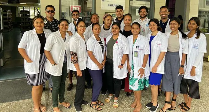 Psychiatric consultant, Dr Sefanaia Qaloewai (back left), with the medical students currently doing psychiatry rotations at St Giles Psychiatric Hospital in Suva. They were part of the clothing drive. 