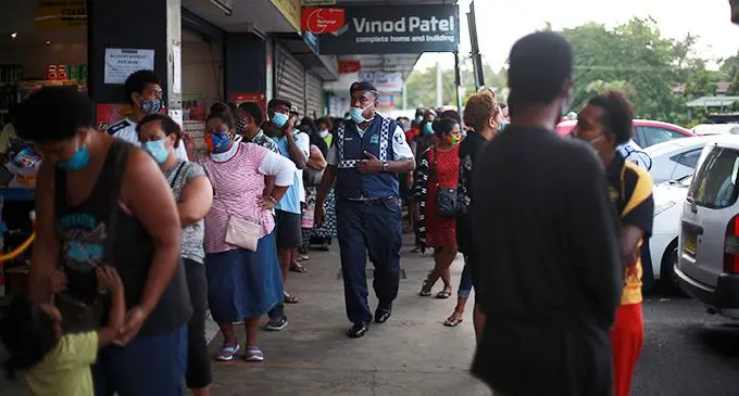 The scene at most supermarkets across the country before the national announcement by Dr James Fong, Permanent Secretary for Health and Medical Services.  Photo: Leon Lord