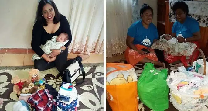 Pranushka Ram and two Kioan ladies holding baby Jeremiah while paying him a visit with baby items in Suva on June 7, 2020. 