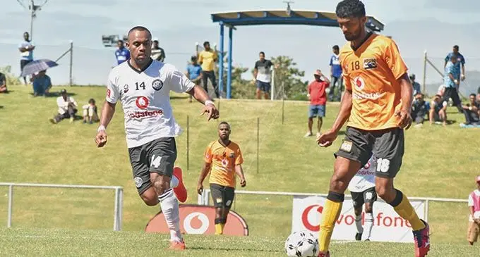 Suva striker Christopher Wasasala pressures the Tavua defence during the Vodafone Fiji FACT pool clash at Lautoka’s Churchill Park on May 4, 2019. Photo: Rohit Kumar