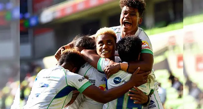 Rooster Chicken Vitalina Naikore celebrates with her team-mates after beating Waratahs 32-26 in the Super W grand final at AAMI Park in Melbourne, Australia, this afternoon. Naikore scored three tries and kicked over a conversion to be named the Player of the Final. William West/AFP