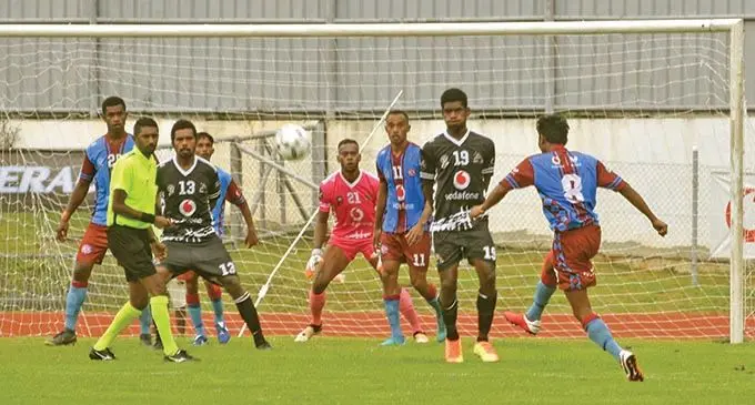  Ba goalkeeper Saula Waqanicakau marshals hs defenders as Nasinu’s Shahil Kumar (8) makes an attempt during the Vodafone Fiji FACT opener at Churchill Park, Lautoka, on November 21, 2020. Photo: Waisea Nasokia