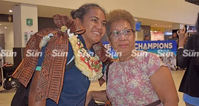 Rooster Chicken Fijiana Drua wing Younis Bese (left) greeted by her mother Lewai Bese at the Nadi International Airport on May 8, 2022. Bese was one of the non travelling reserve for athletics considered for the Saipan Mini Games, however she was dropped because of her commitment to rugby. Photo: Mereleki Nai