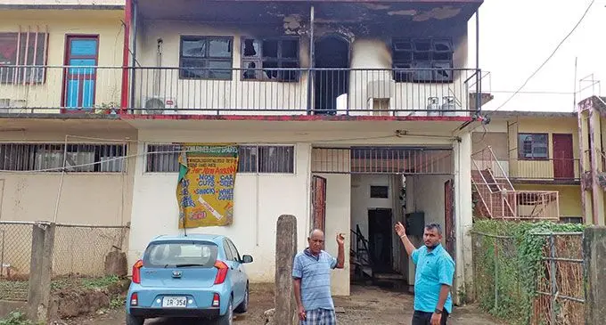 Gyan Singh (left) and his son Avineet Ajneet Singh infront of the burned flat at Bank street,Ba on June 13,2022.  Photo: Salote Qalubau