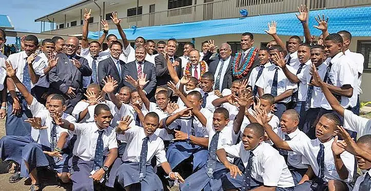 Director General for Information and Public Diplomacy, Ministry of Foreign Affairs Indonesia, Teuku Faizasyah (left with garland) and Fiji’s Minister for Education Aseri Radrodro with students of Queen Victoria School in front of their newly commissioned school block on August 3, 2023. Photo: Sereana Salalo