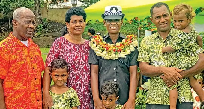 Police Constable Liliana Tora (garlanded) with her family (from left:) Father Ifereimi Tora, mother Koila Waqaniburotu, husband  Nokamua Atunaisa and her three daughters Yallah Berth, Loraini Cakau and Meredani Hope.  Photo: Kelera Sovasiga