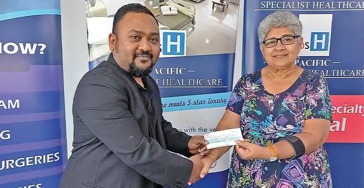Pacific Specialist Healthcare managing director Parvish Kumar (left) handing over the cheque to Shamima Ali, coordinator for the Fiji Women’s Crisis Centre. Photo: Charles Chambers
