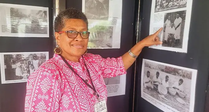 Kelera Oli, a descendant of Solomon Islanders points at an image of her late father. Photo: Sosiveta Korobiau