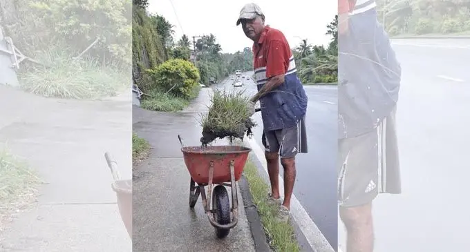 Suresh Behari cleaning the Caubati 2 Road.