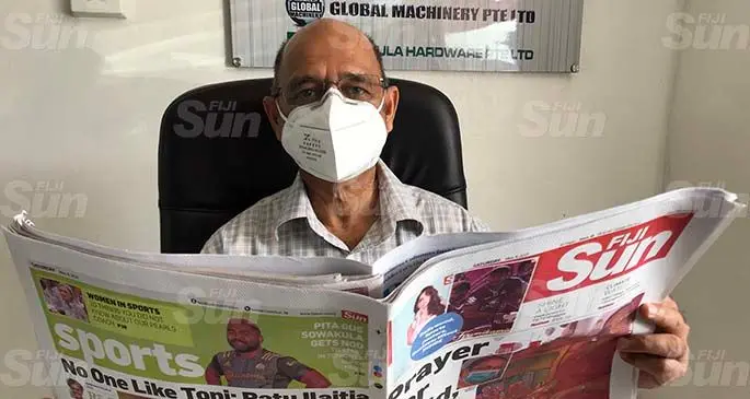 A.Hussain and Company Pte Limited managing director Hazeem Hussain reads Saturday’s Fiji Sun in his office in Labasa yesterday.