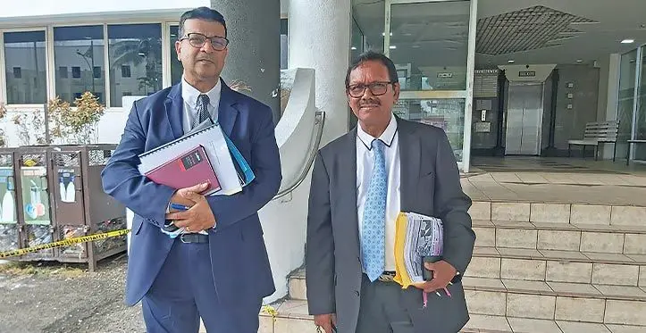 Former Fijian Electoral Commission chairperson Suresh Chandra with his lawyer Devanesh Sharma outside Independent Legal Services Commission in Suva on March 21, 2023.. Photo: Ashna Kumar
