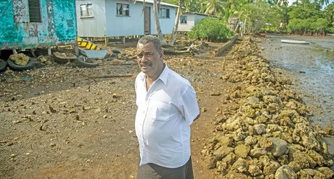 Veivatuloa Village headman Leone Nairuwai stands on what is left of their village seawall on April 21, 2022. Photo: Leon Lord