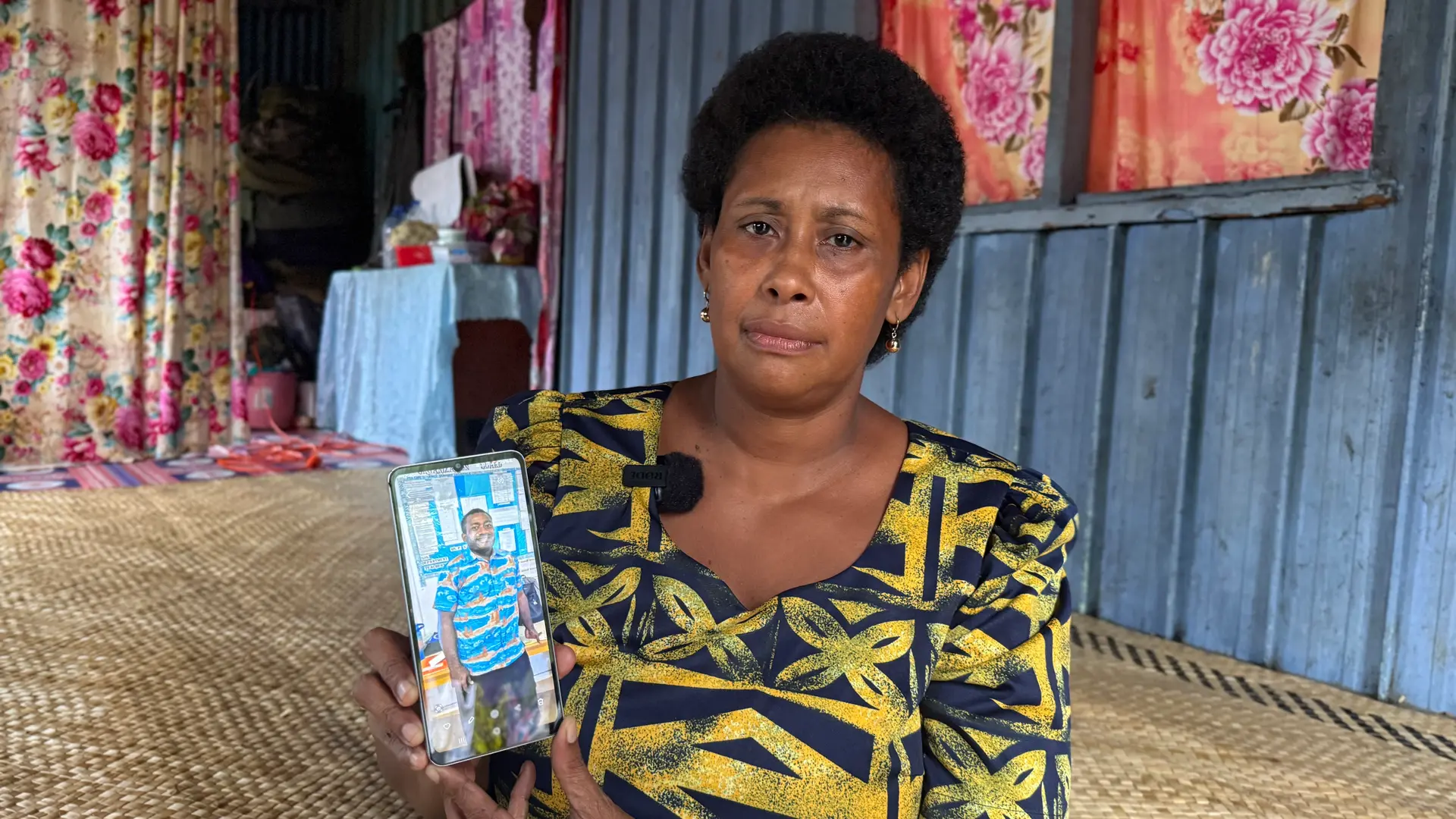 Karalaini Tamani showing a photo of the late Mateo Nabalemoto.