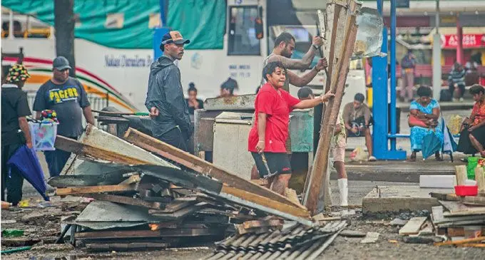 Vendor Filisita Sameke (red T-shirt) remains optimistic of a brighter future as the Suva City Council plans to redevelop the Suva Bus Station and business stalls this year. Photo: Leon Lord 
