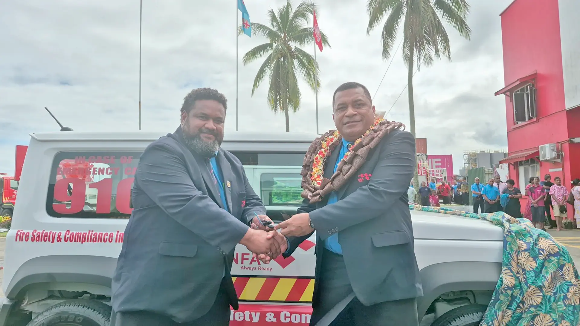 Minister for Housing Maciu Nalumisa handing over the new car keys to National Fire Authority manager fire safety and compliance Joel Israel on May 13, 2026. 
