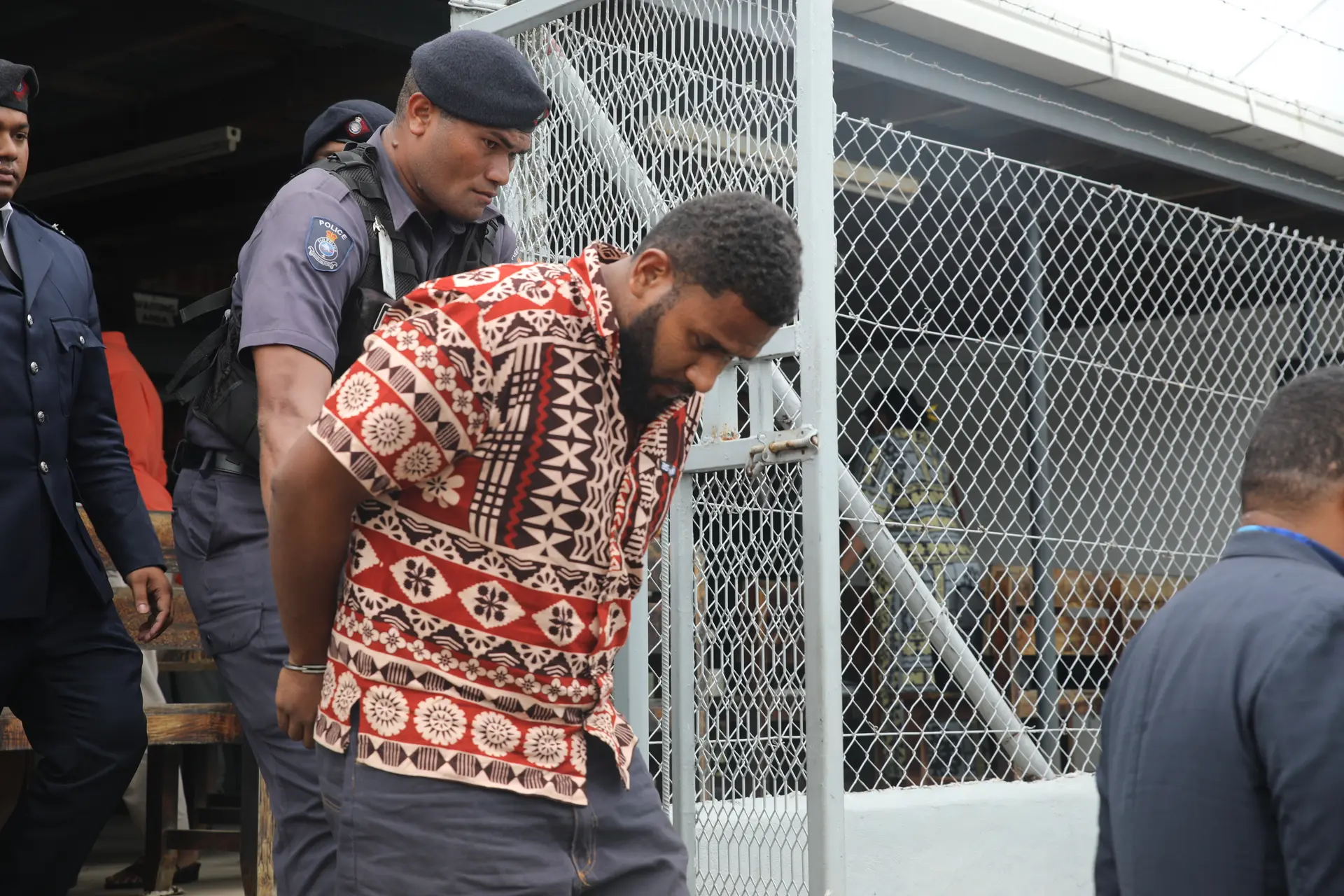 Australian passport holder Bainivalu Suguturaga escorted by the police at the Rakiraki Magistrate court.