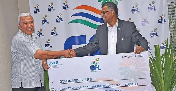Deputy Prime Minister and Minister for Finance Biman Prasad receives the dividend cheque from EFL Board Directors Gardiner Whiteside on July 20, 2023. Photo: DEPTFO